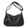 Black leather hobo bag with quilted wave pattern silver hardware and adjustable strap