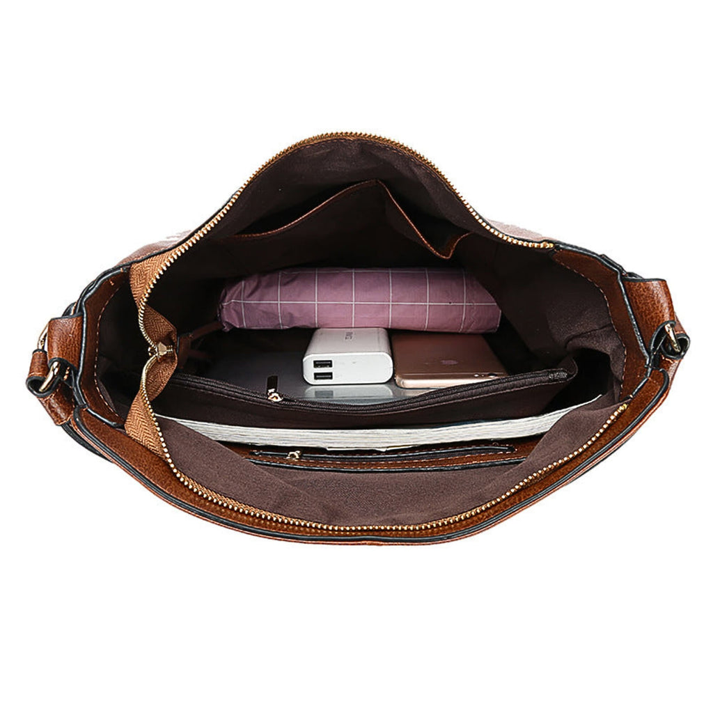 Interior view of brown leather hobo bag showing spacious compartments and pockets