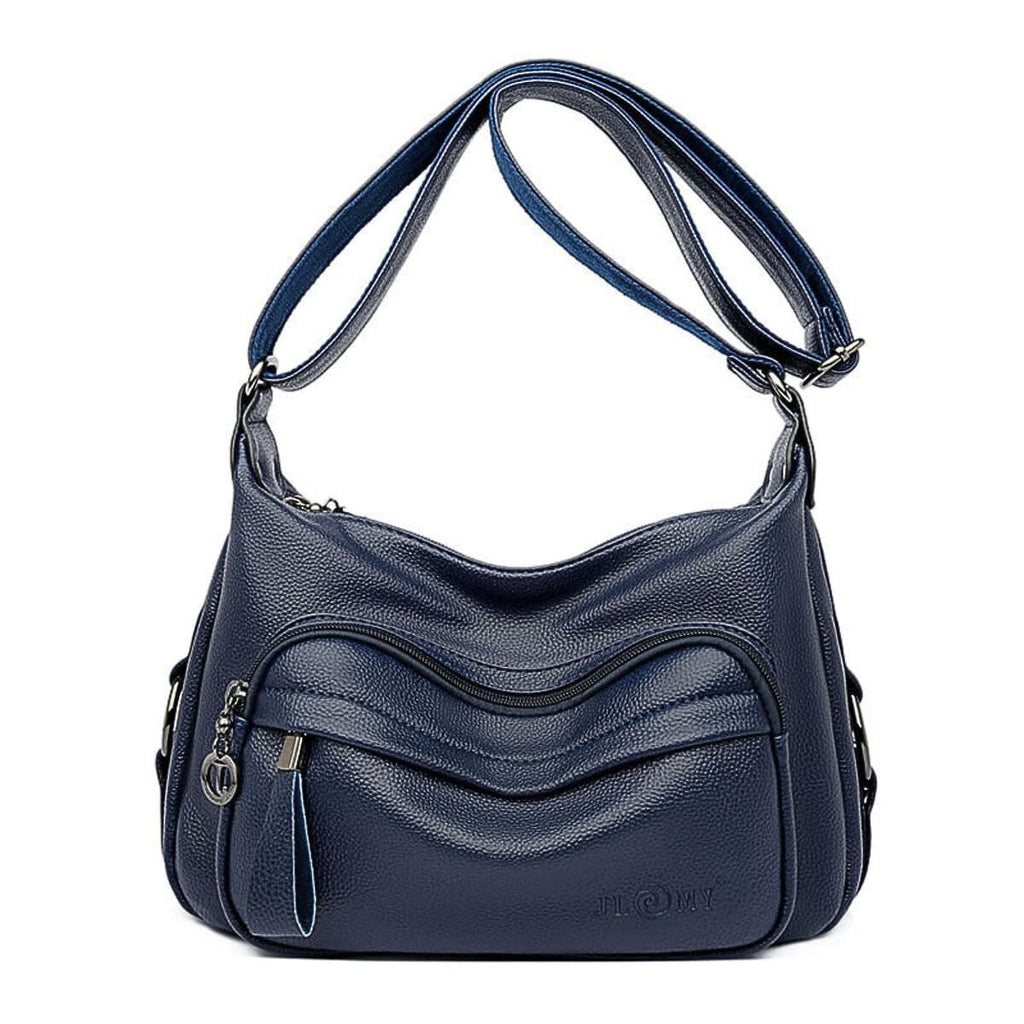 Navy blue leather hobo bag with quilted wave pattern and silver hardware adjustable strap
